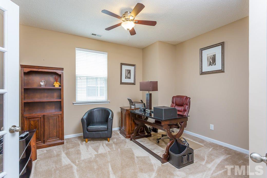5716 Sea Fox Court Raleigh, NC 27616 - Photo 17 of 23 a living room with furniture and a window