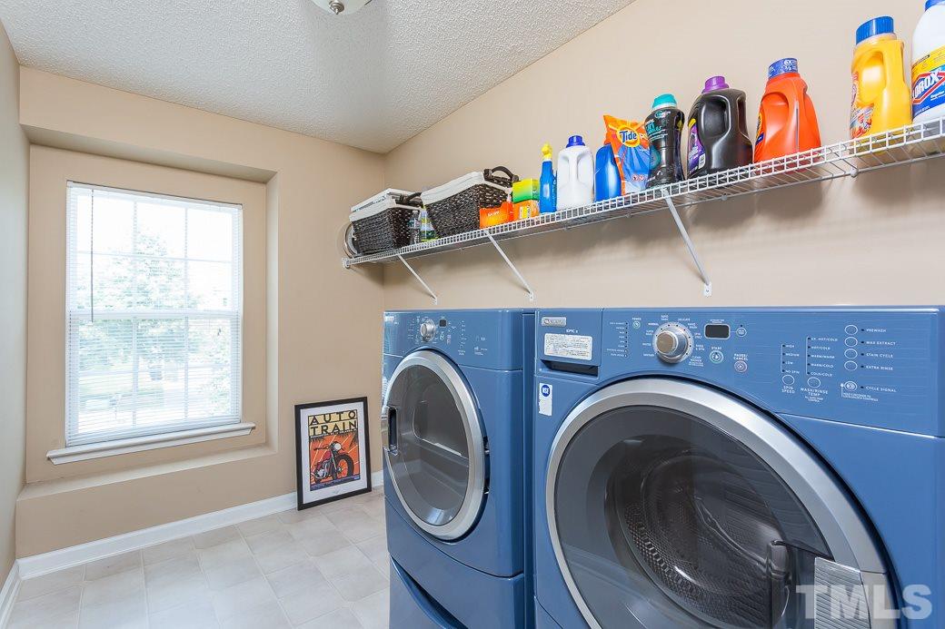 5716 Sea Fox Court Raleigh, NC 27616 - Photo 19 of 23 a utility room with dryer and washer