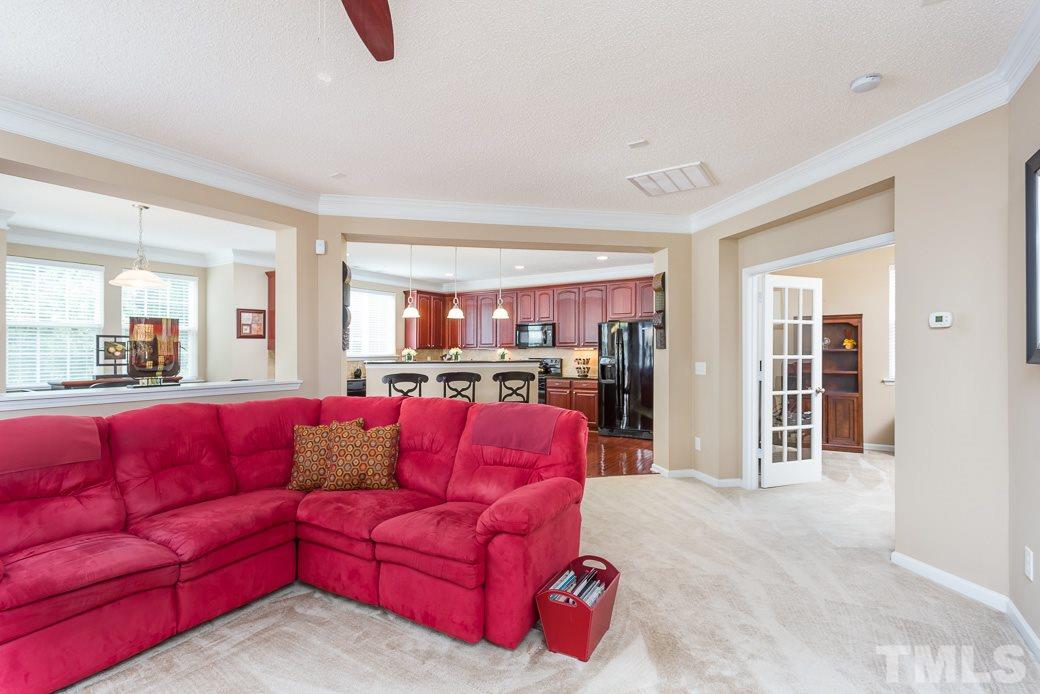 5716 Sea Fox Court Raleigh, NC 27616 - Photo 3 of 23 a living room with furniture couch and kitchen view