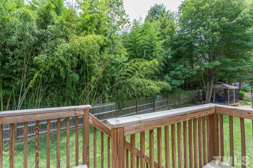 5716 Sea Fox Court Raleigh, NC 27616 - Photo 21 of 23 a view of deck with furniture and trees