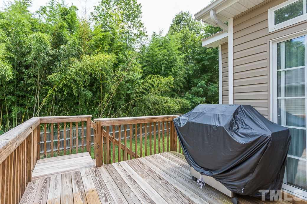 5716 Sea Fox Court Raleigh, NC 27616 - Photo 22 of 23 a view of balcony with wooden floor and outdoor seating