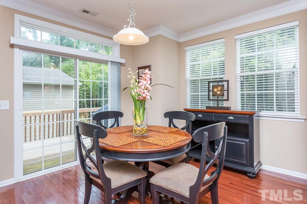 5716 Sea Fox Court Raleigh, NC 27616 - Photo 6 of 23 a view of a dining room with furniture window and wooden floor