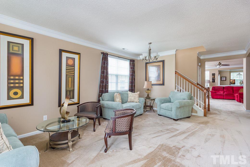 5716 Sea Fox Court Raleigh, NC 27616 - Photo 7 of 23 a living room with furniture and windows