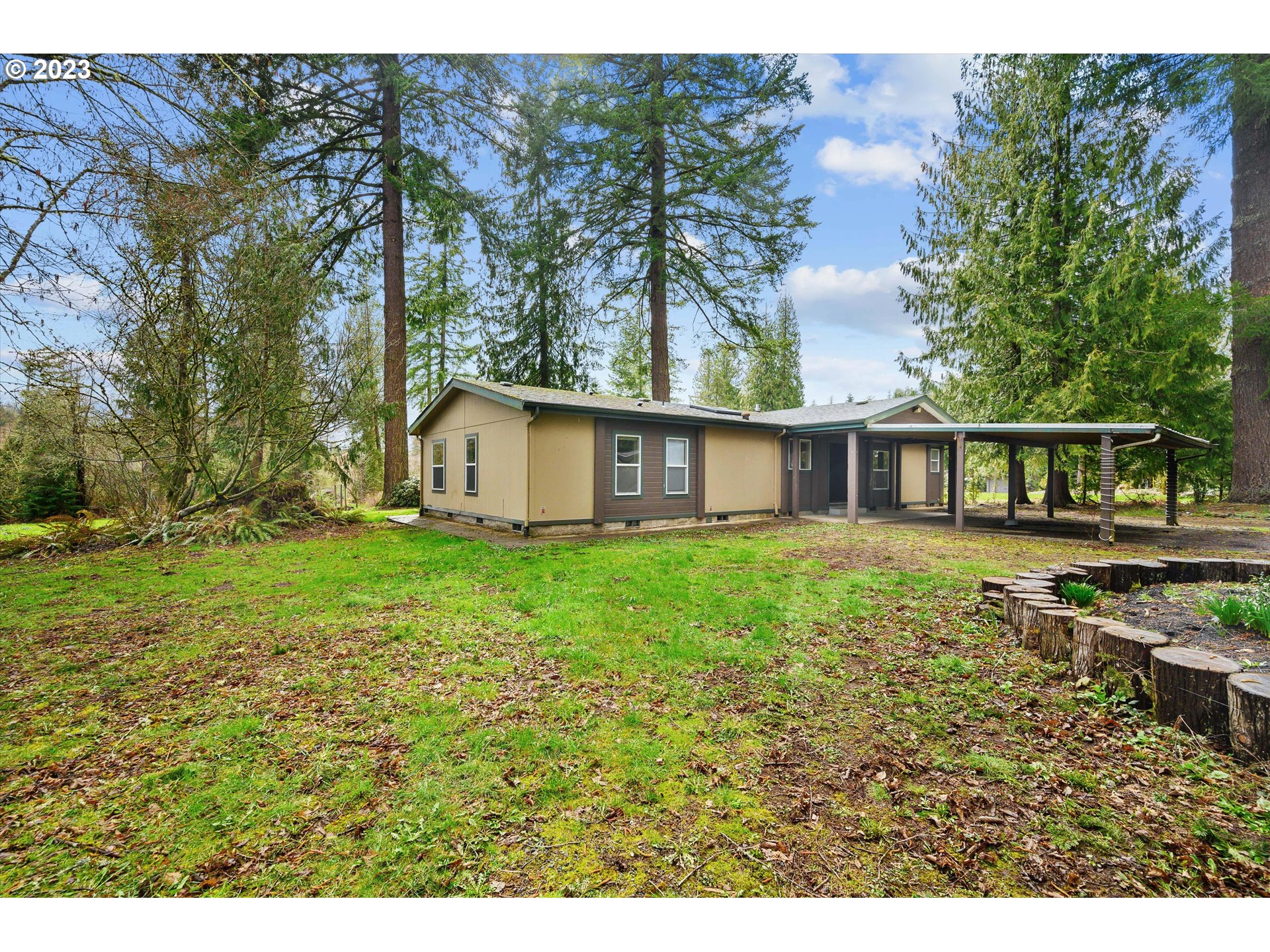 42264 Southeast Locksmith Lane Sandy, OR 97055 - Photo 2 of 36 a view of a house with backyard and sitting area