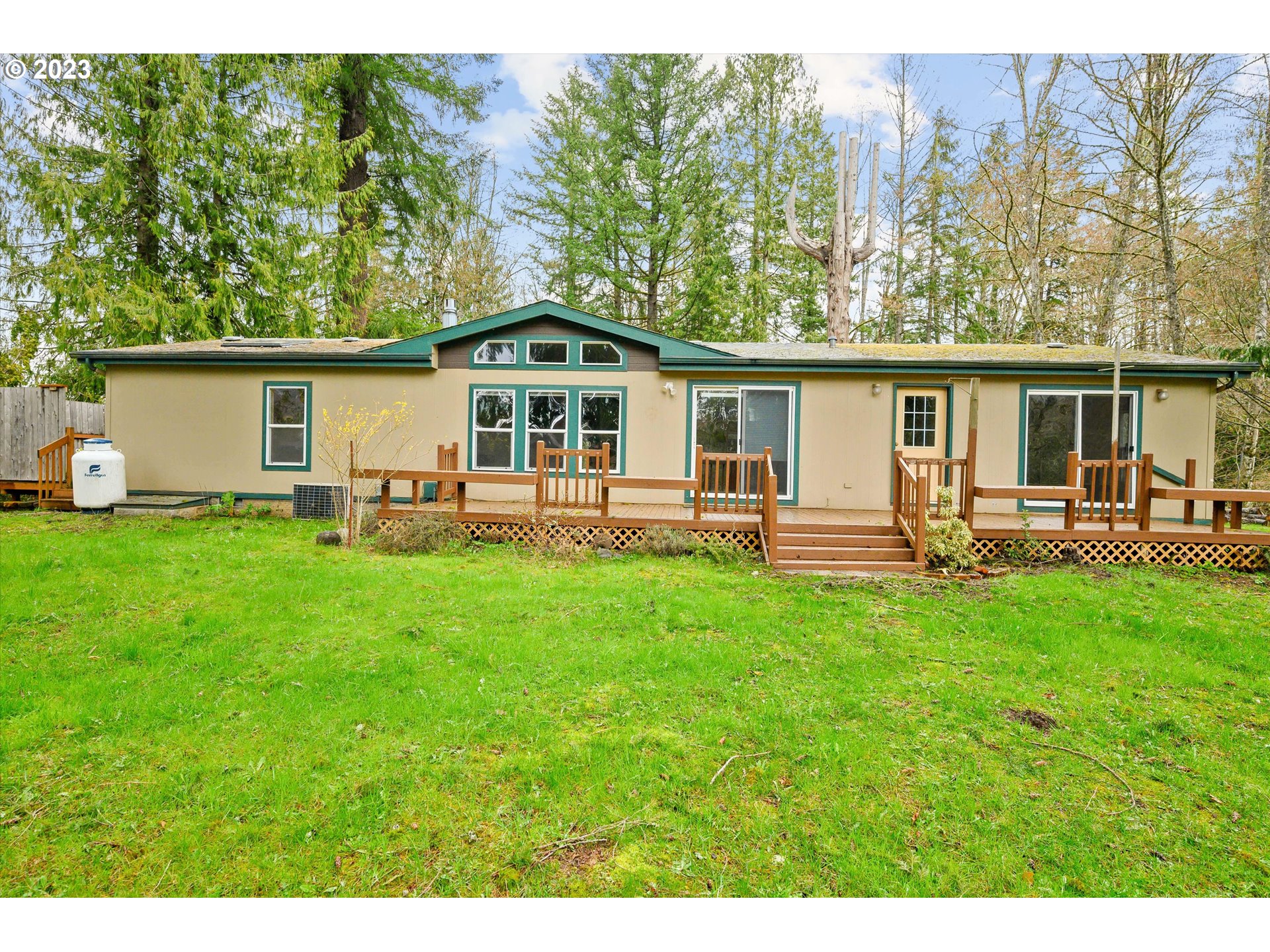 42264 Southeast Locksmith Lane Sandy, OR 97055 - Photo 24 of 36 a front view of house with yard and trees