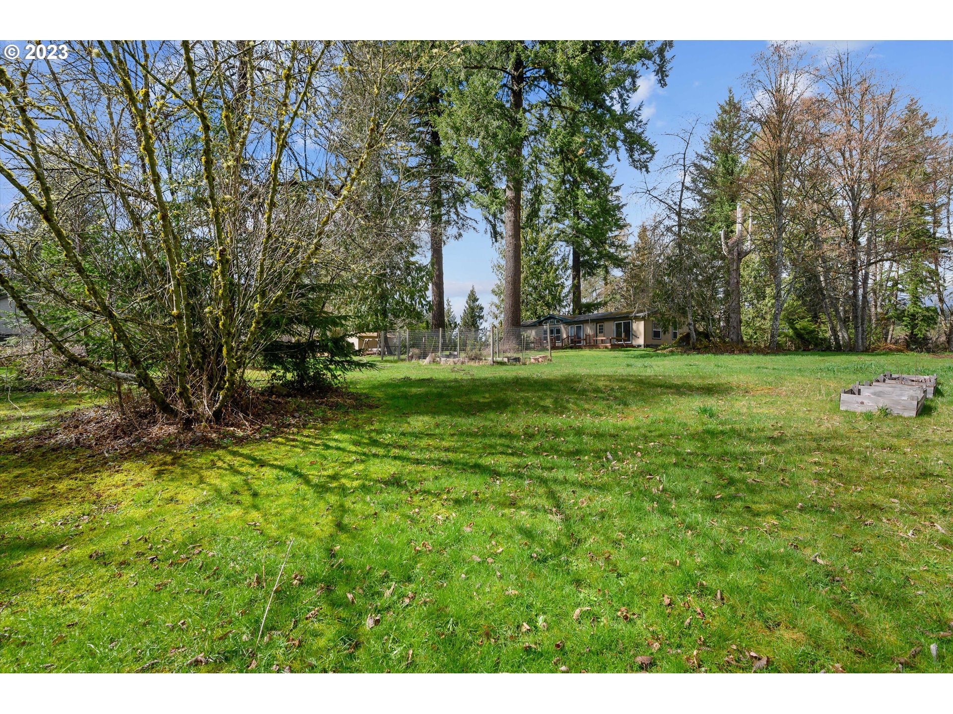 42264 Southeast Locksmith Lane Sandy, OR 97055 - Photo 27 of 36 a backyard of a house with lots of green space