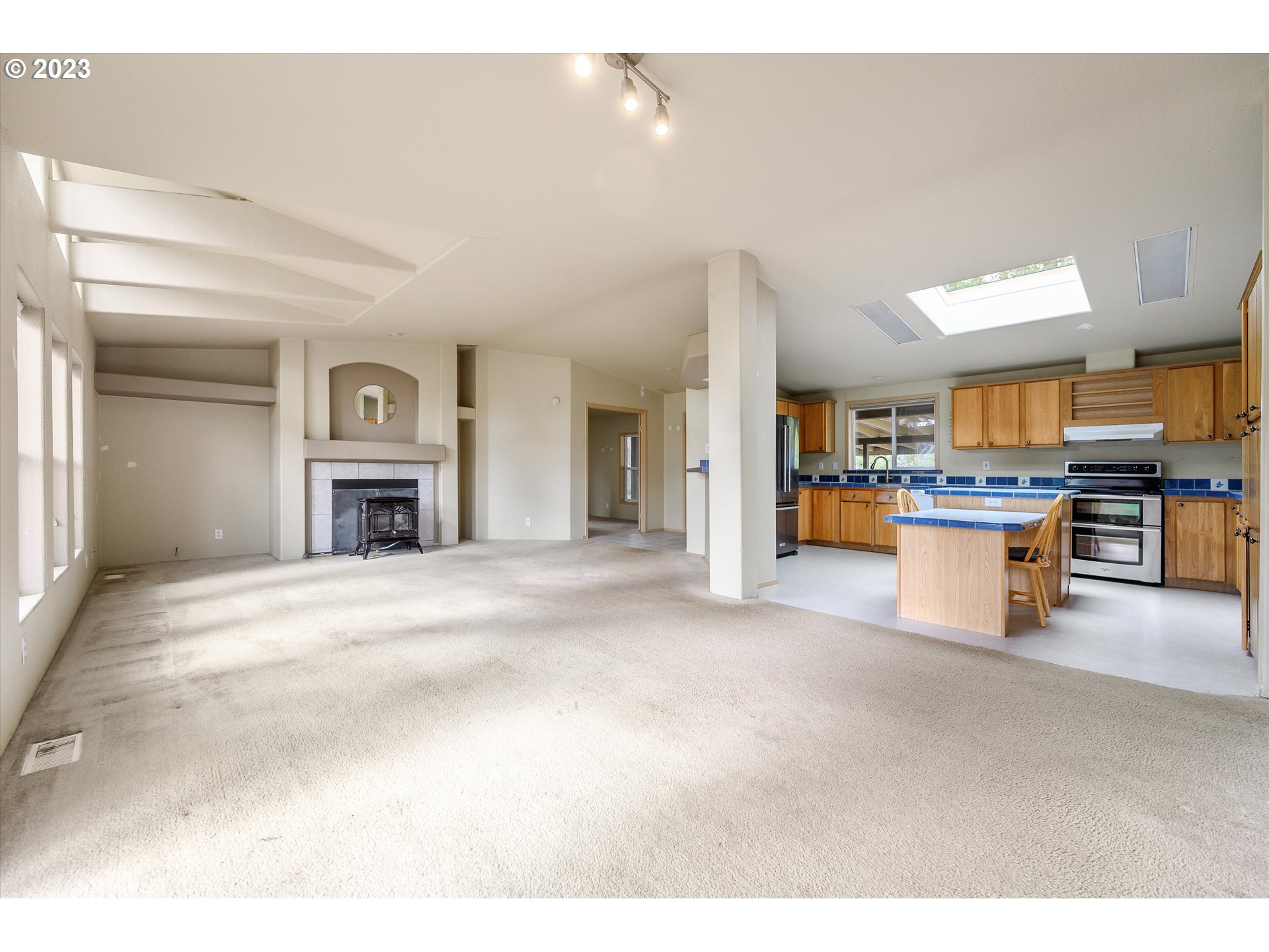 42264 Southeast Locksmith Lane Sandy, OR 97055 - Photo 6 of 36 a view of a kitchen with a stove cabinets and a kitchen