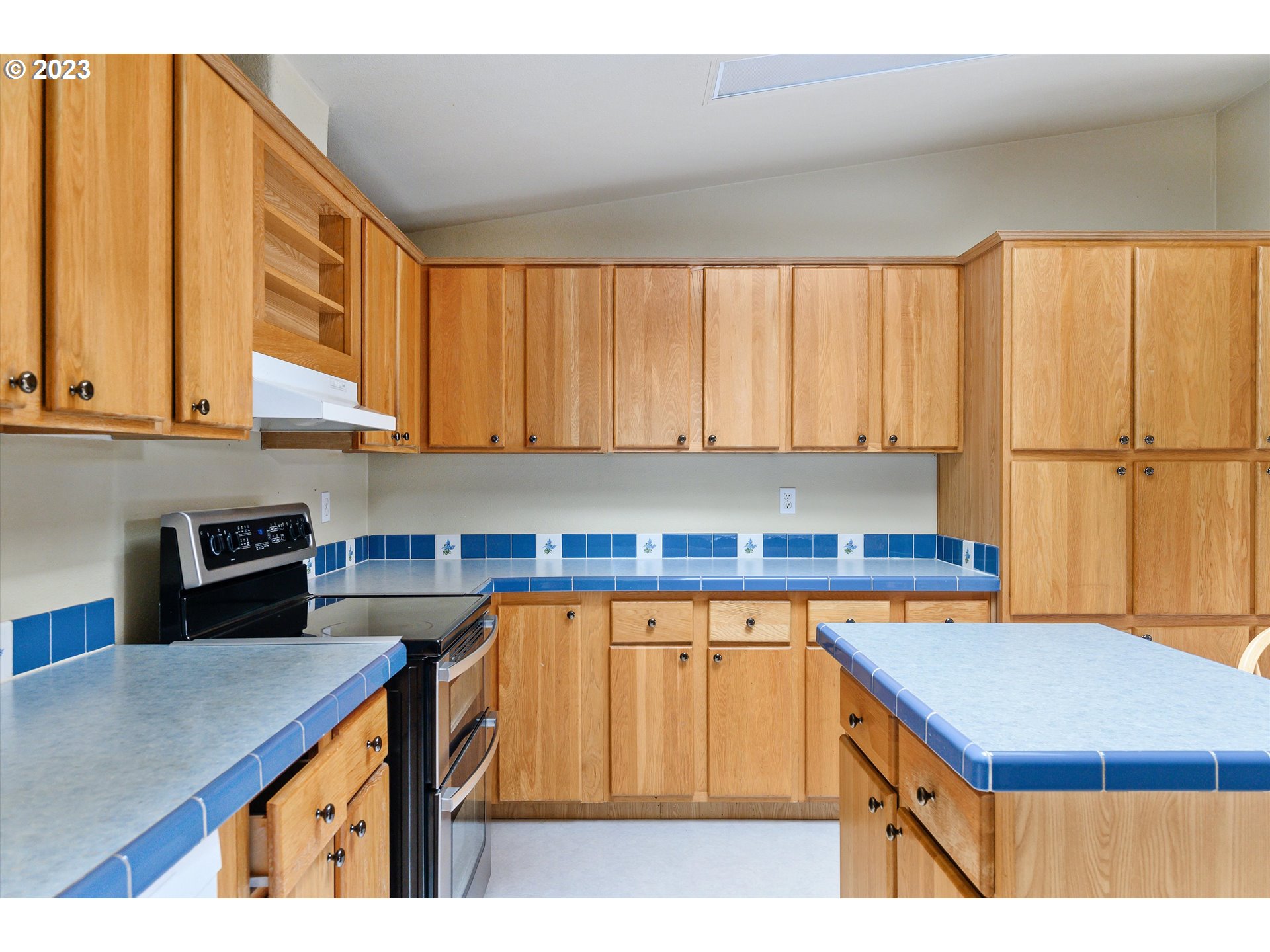 42264 Southeast Locksmith Lane Sandy, OR 97055 - Photo 10 of 36 a kitchen with a sink a counter top space and cabinets
