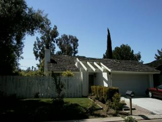 6183 Flowering Plum Road San Jose, CA 95120 - Photo 1 of 1 a front view of a house with garden