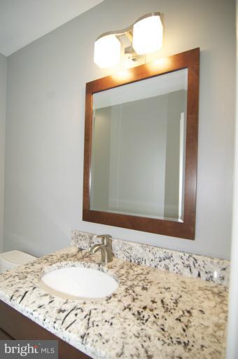 3203 Park View Road Chevy Chase, MD 20815 - Photo 3 of 30 a bathroom with a sink and a mirror