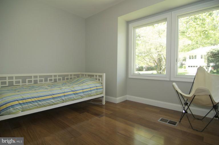3203 Park View Road Chevy Chase, MD 20815 - Photo 22 of 30 a view of a room with wooden floor and chair