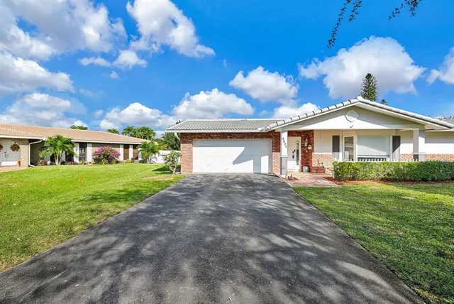 a view of a backyard with sitting area and barbeque oven