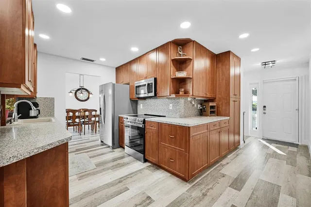 a view of a storage and utility room with washer and dryer