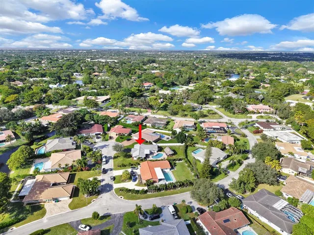 an aerial view of residential houses with outdoor space