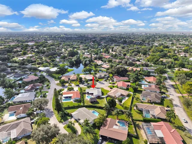 an aerial view of residential houses with outdoor space
