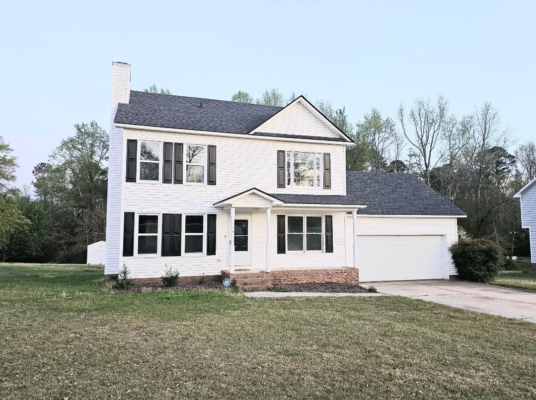 250 Pope Lake Road Angier, NC 27501 - Photo 7 of 8 a front view of a house with a yard