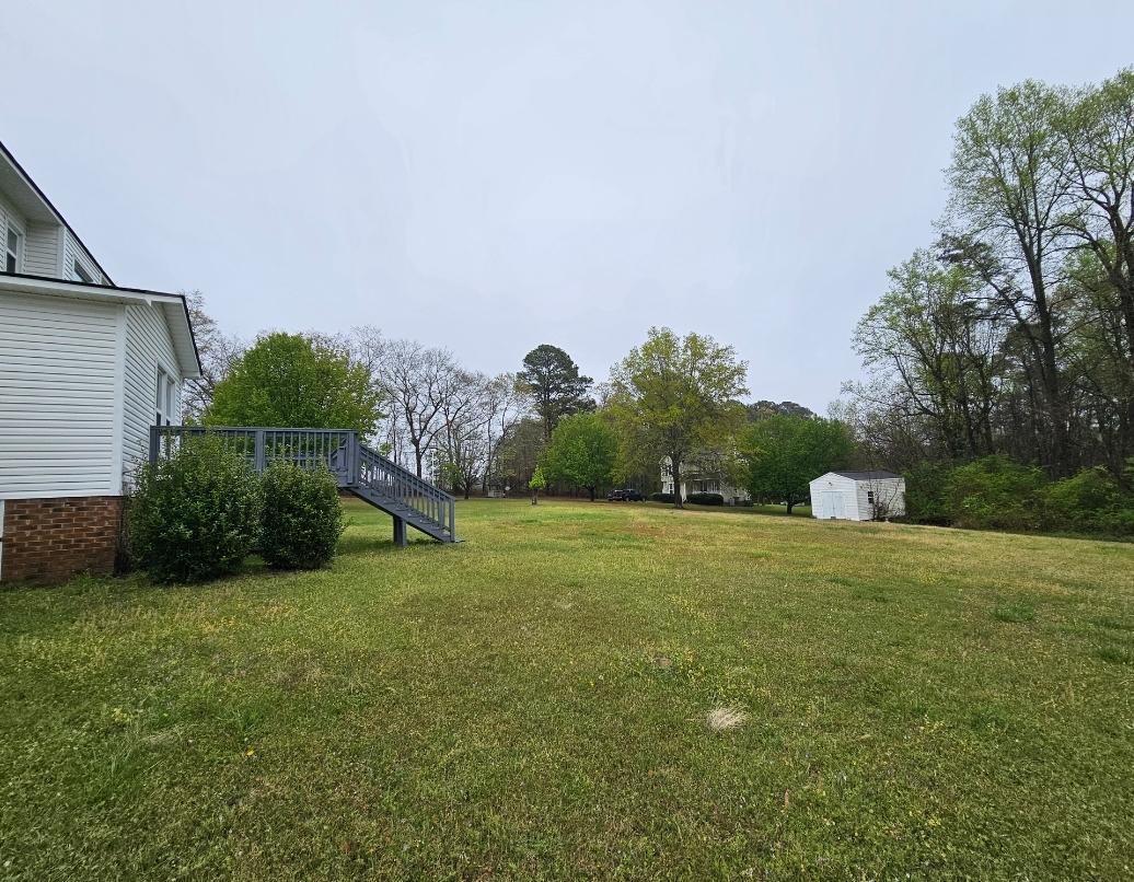 250 Pope Lake Road Angier, NC 27501 - Photo 8 of 8 a view of a field of grass and trees