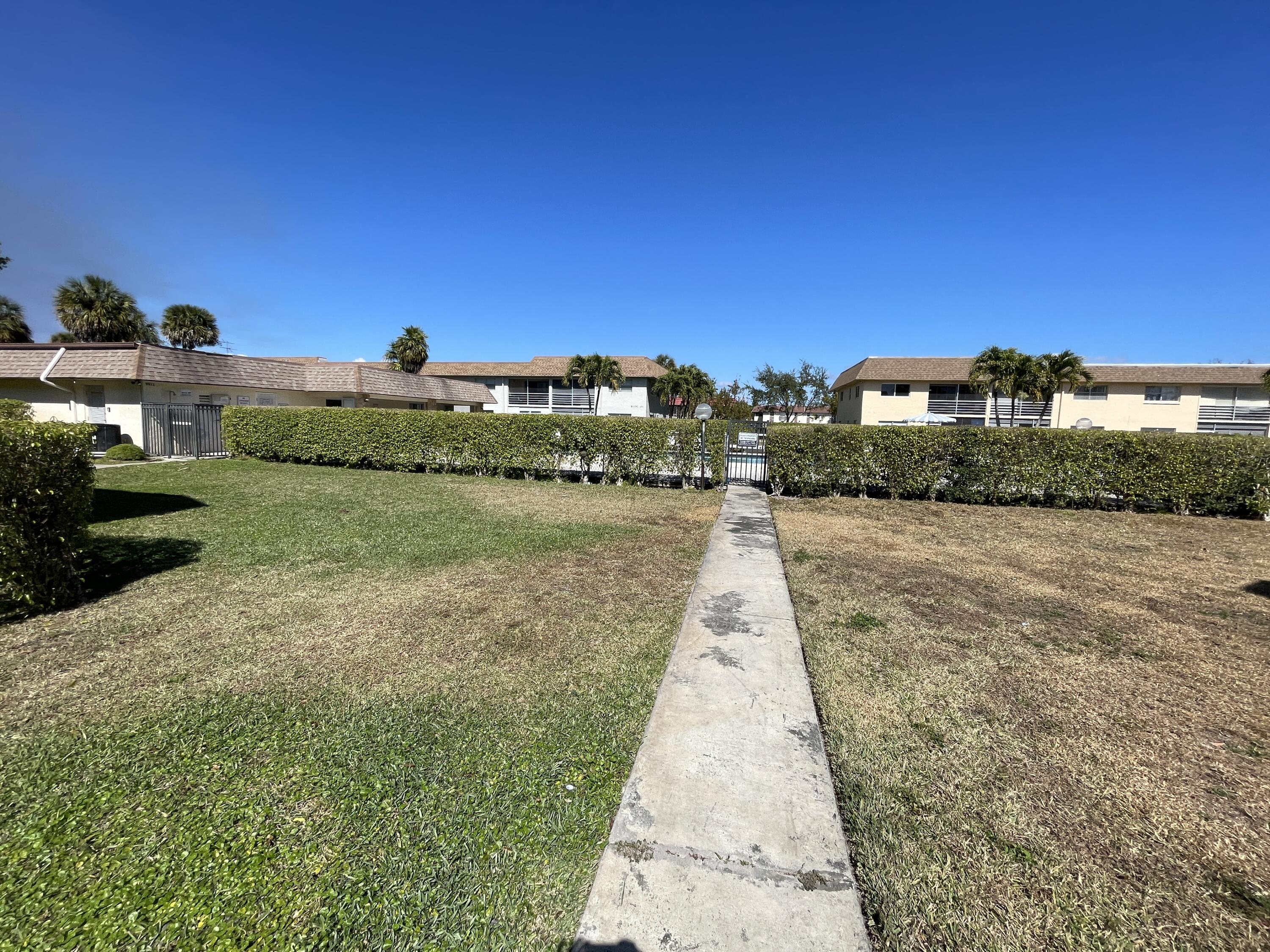 9911 Sandalfoot Boulevard, Unit 112 Boca Raton, FL 33428 - Photo 7 of 13 IMG_2373