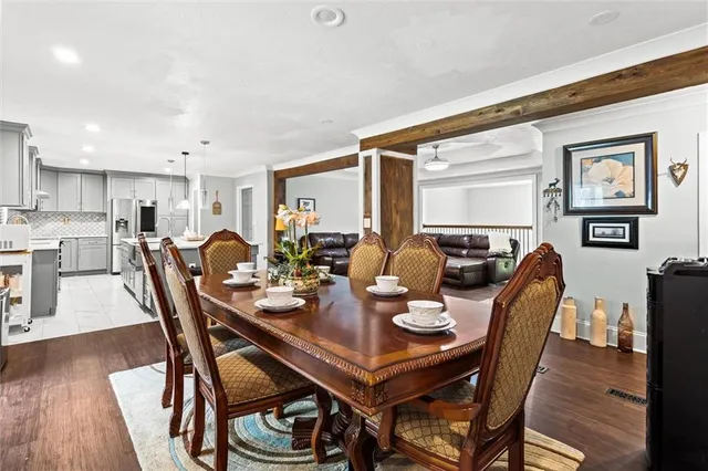 a view of a workspace with furniture and wooden floor