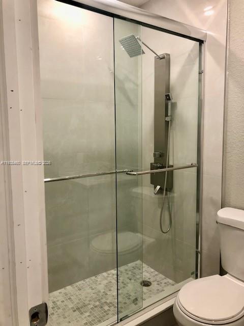 3440 Southwest 7th Street, Unit 1 Miami, FL 33135 - Photo 5 of 14 a bathroom with a shower and toilet