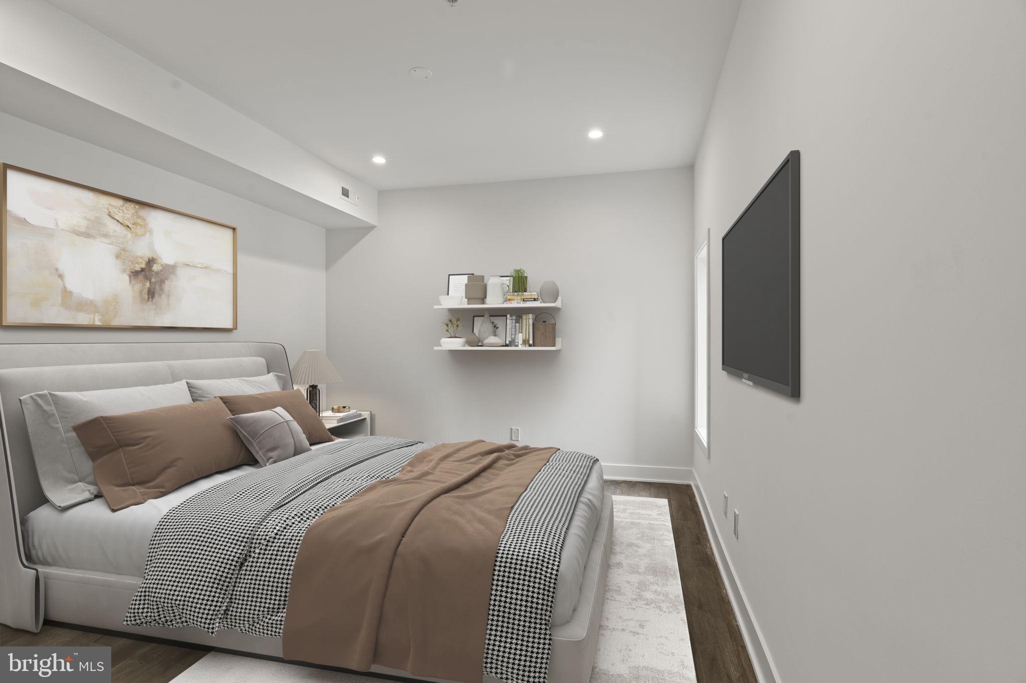 1244 South 20th Street, Unit 2 Philadelphia, PA 19146 - Photo 14 of 28 a bedroom with a large bed and a painting on the wall