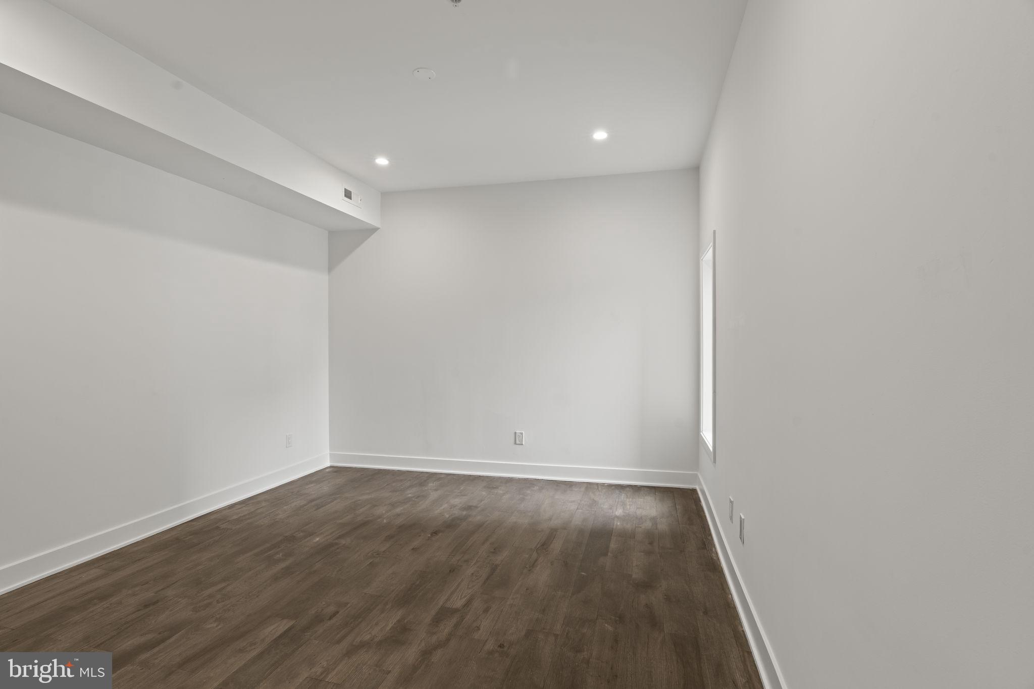 1244 South 20th Street, Unit 2 Philadelphia, PA 19146 - Photo 15 of 28 a view of room with wooden floor