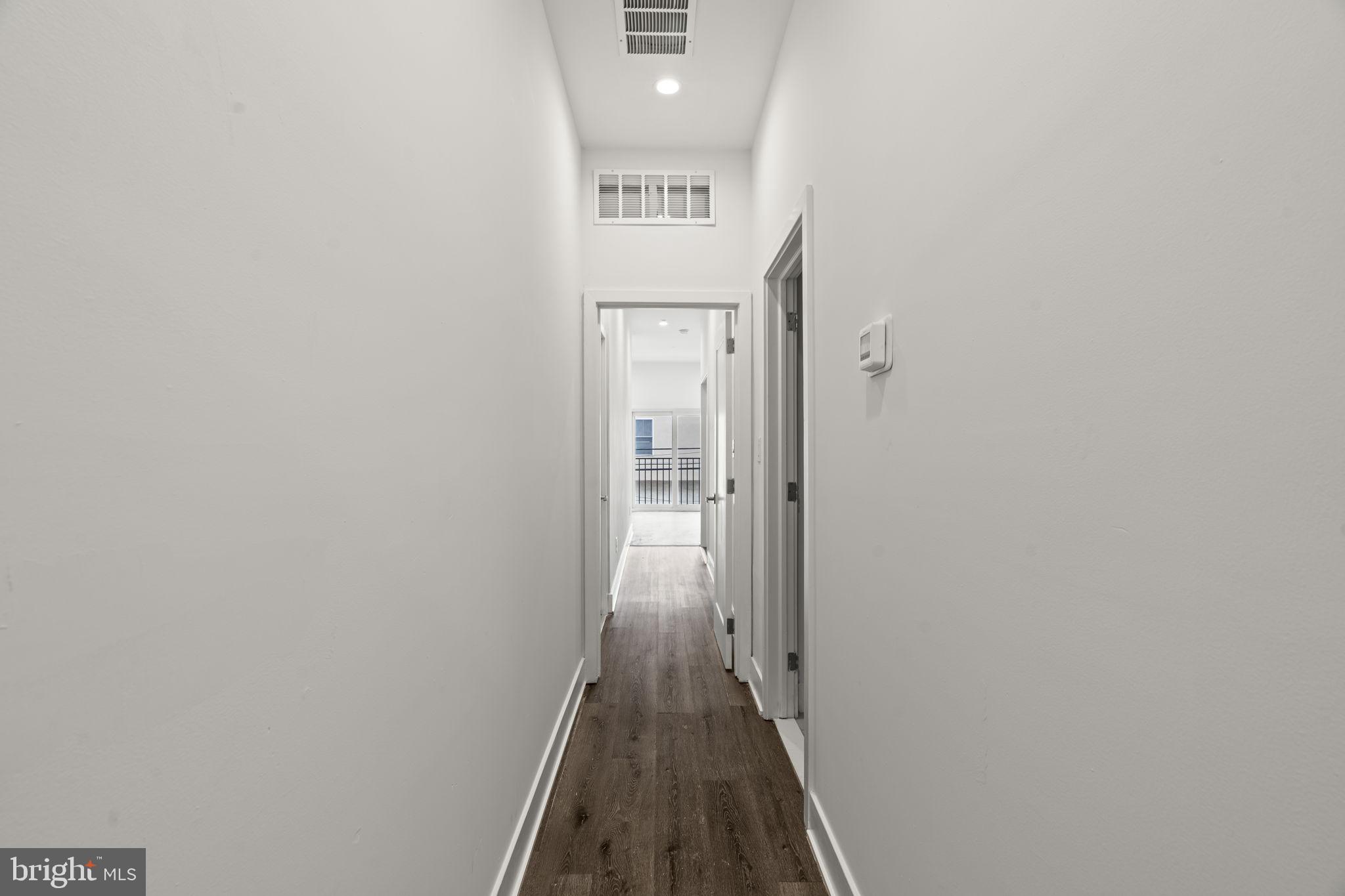 1244 South 20th Street, Unit 2 Philadelphia, PA 19146 - Photo 18 of 28 a view of a hallway with wooden floor