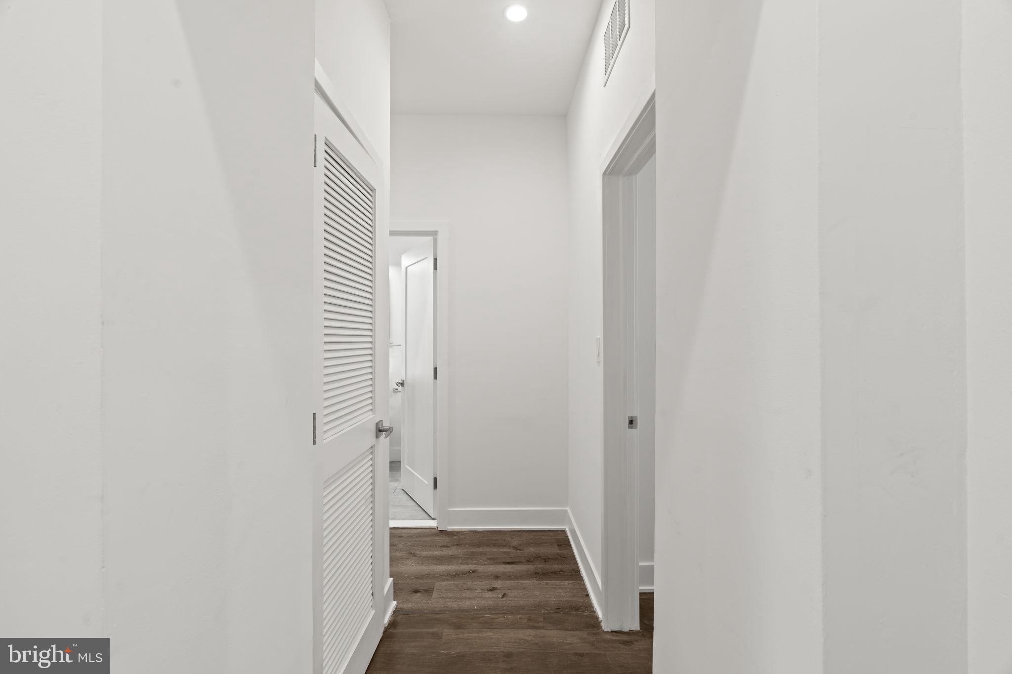 1244 South 20th Street, Unit 2 Philadelphia, PA 19146 - Photo 19 of 28 a view of a hallway with wooden floor and staircase