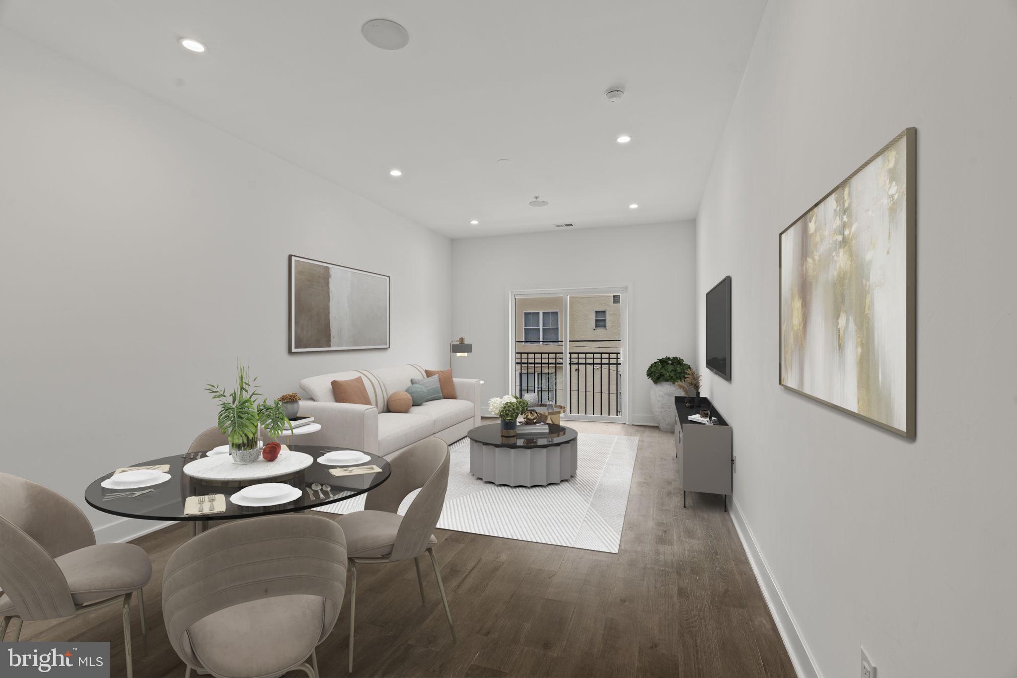 1244 South 20th Street, Unit 2 Philadelphia, PA 19146 - Photo 2 of 28 a living room with furniture potted plant and a window