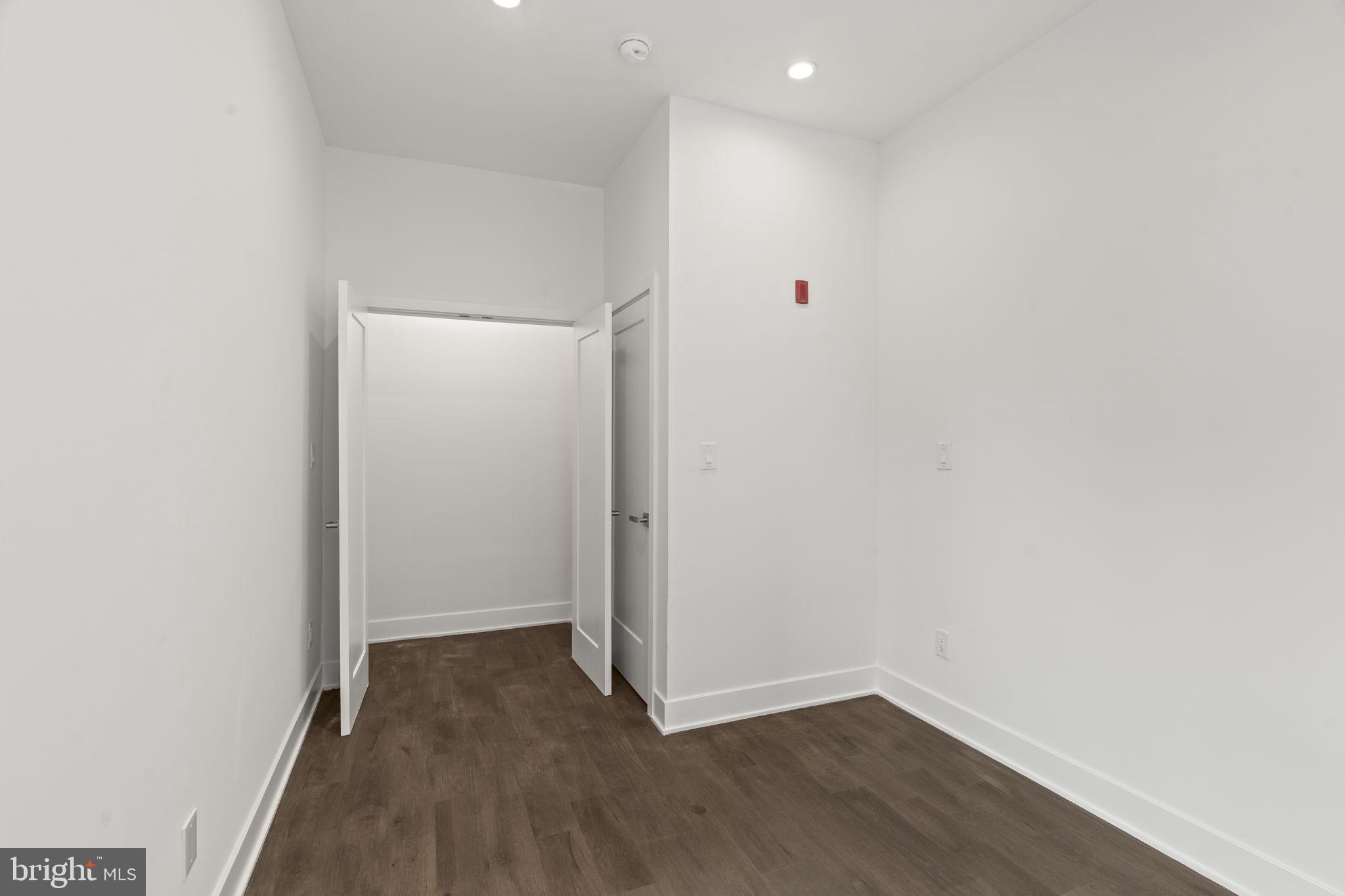 1244 South 20th Street, Unit 2 Philadelphia, PA 19146 - Photo 21 of 28 a view of an empty room with wooden floor