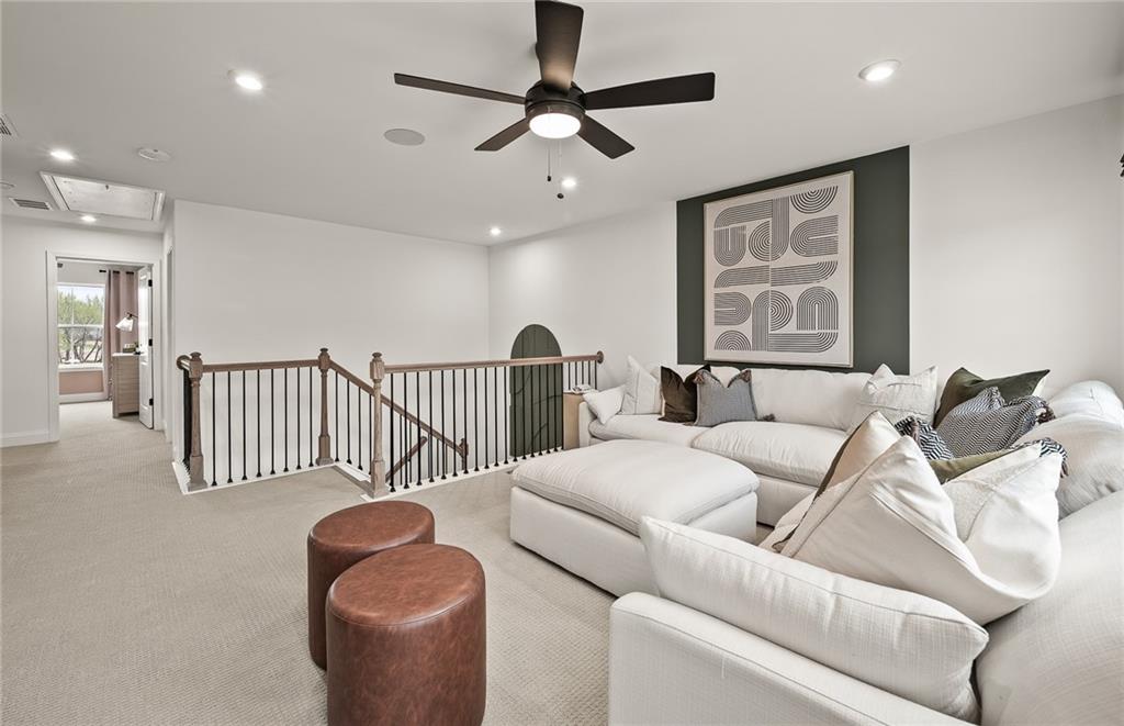1601 Wander Mill Cumming, GA 30040 - Photo 20 of 32 a living room with furniture and a chandelier