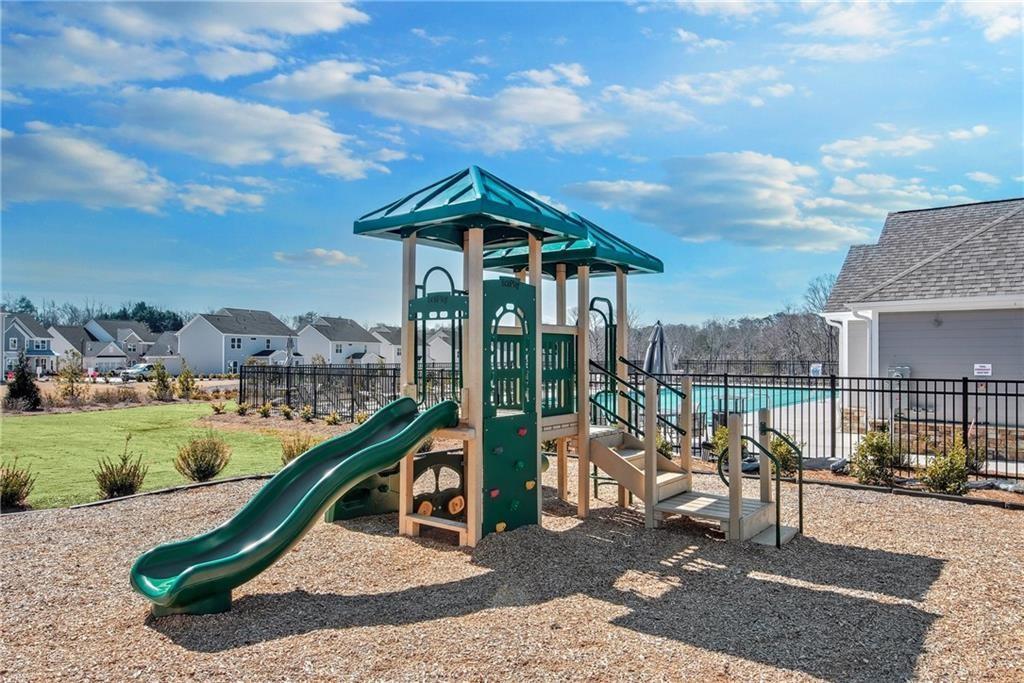 1601 Wander Mill Cumming, GA 30040 - Photo 31 of 32 a view of a garden with a slide