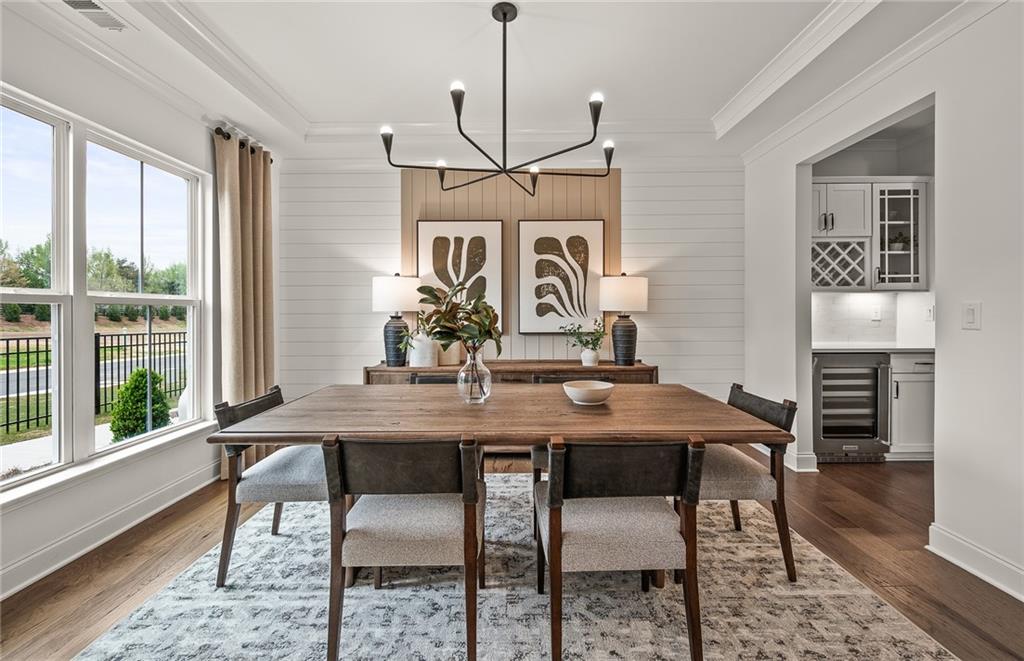 1601 Wander Mill Cumming, GA 30040 - Photo 5 of 32 a view of a dining room with furniture window and wooden floor