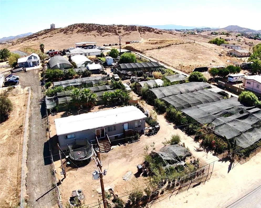 22861 Betty Road Perris, CA 92570 - Photo 6 of 13 an aerial view of a house with a yard and ocean view