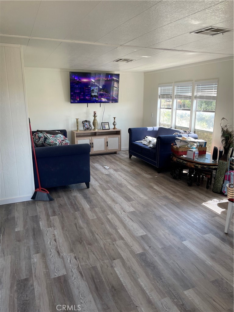 22861 Betty Road Perris, CA 92570 - Photo 10 of 13 a living room with furniture and wooden floor