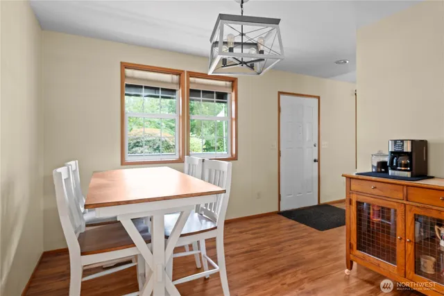 a dining room with wooden floor