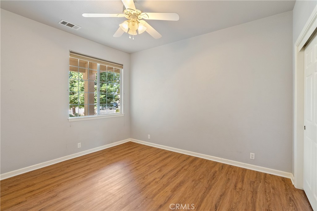 830 Sycamore Canyon Road Paso Robles, CA 93446 - Photo 14 of 27 an empty room with wooden floor and windows
