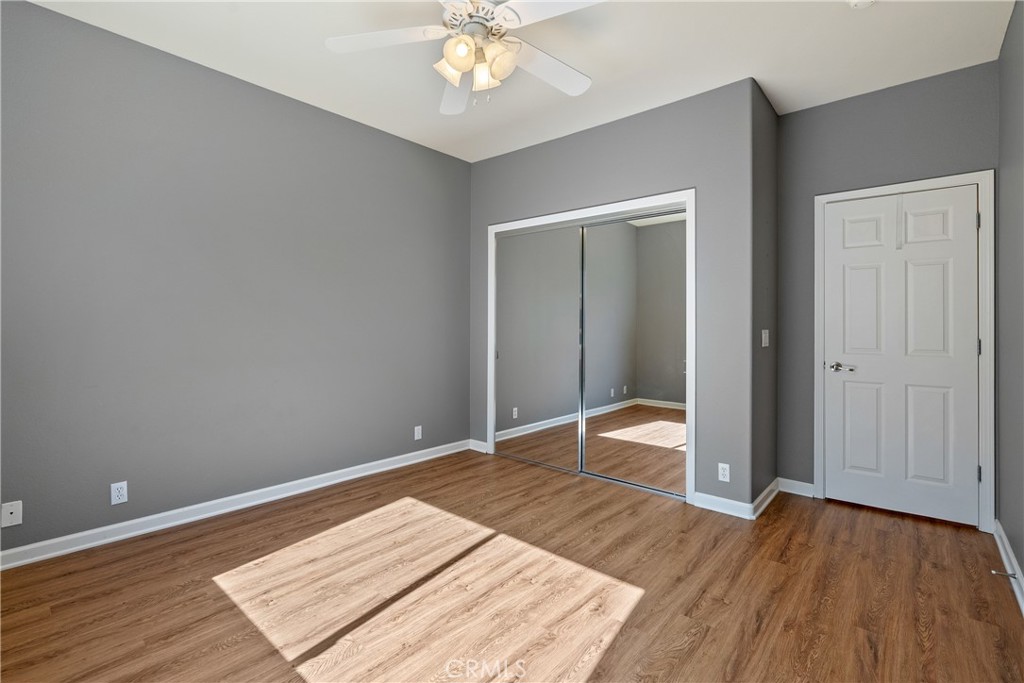 830 Sycamore Canyon Road Paso Robles, CA 93446 - Photo 17 of 27 an empty room with wooden floor closet and chandelier