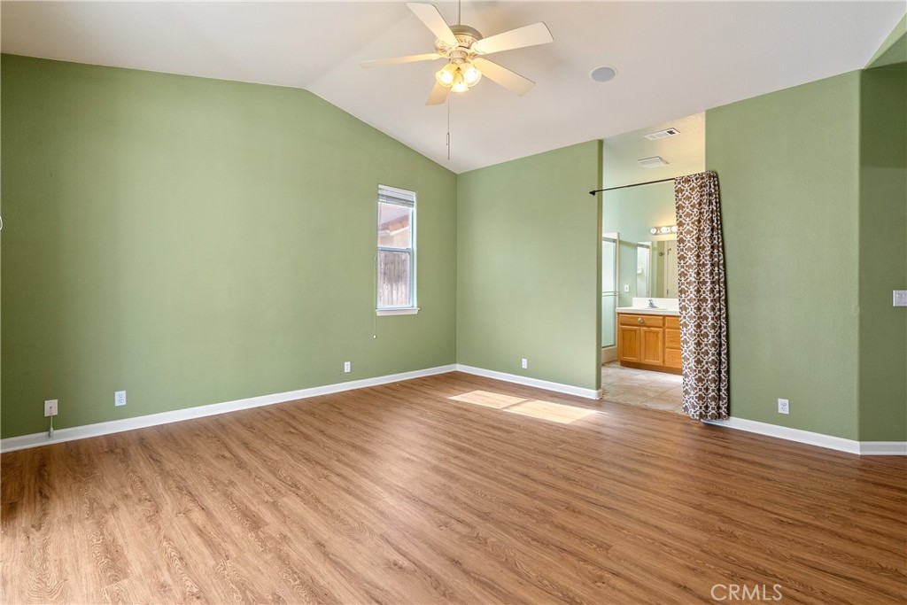 830 Sycamore Canyon Road Paso Robles, CA 93446 - Photo 19 of 27 an empty room with wooden floor and windows