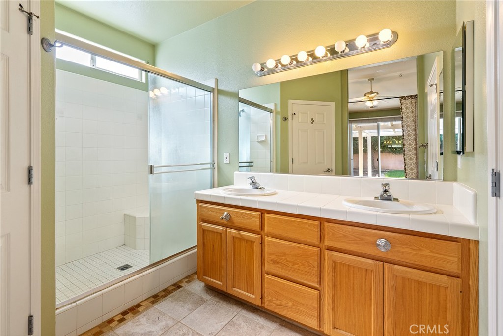 830 Sycamore Canyon Road Paso Robles, CA 93446 - Photo 20 of 27 a bathroom with a granite countertop sink mirror and double