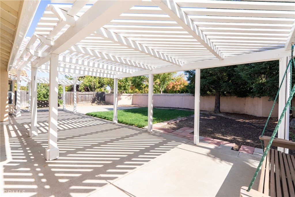 830 Sycamore Canyon Road Paso Robles, CA 93446 - Photo 25 of 27 a view of a patio with a table and chairs next to a yard