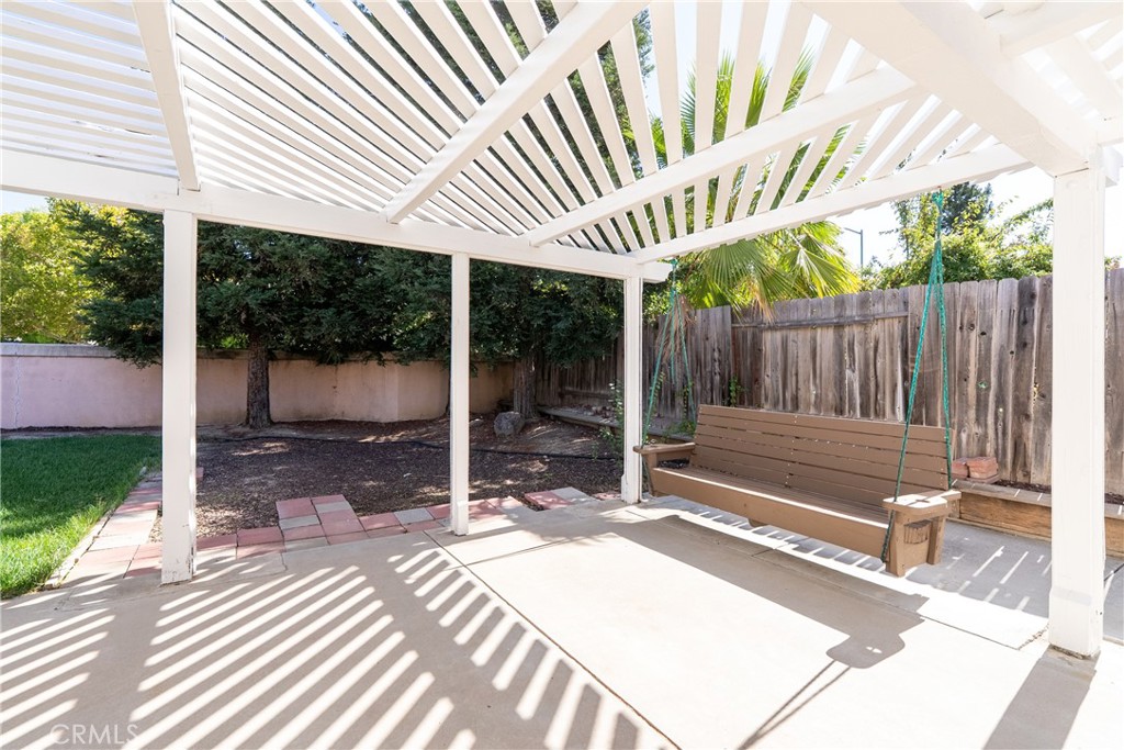 830 Sycamore Canyon Road Paso Robles, CA 93446 - Photo 26 of 27 a view of a backyard with a patio and wooden fence