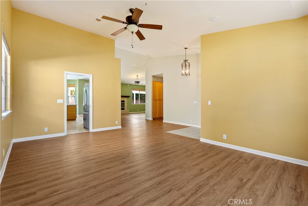 830 Sycamore Canyon Road Paso Robles, CA 93446 - Photo 5 of 27 a view of empty room with wooden floor and ceiling fan