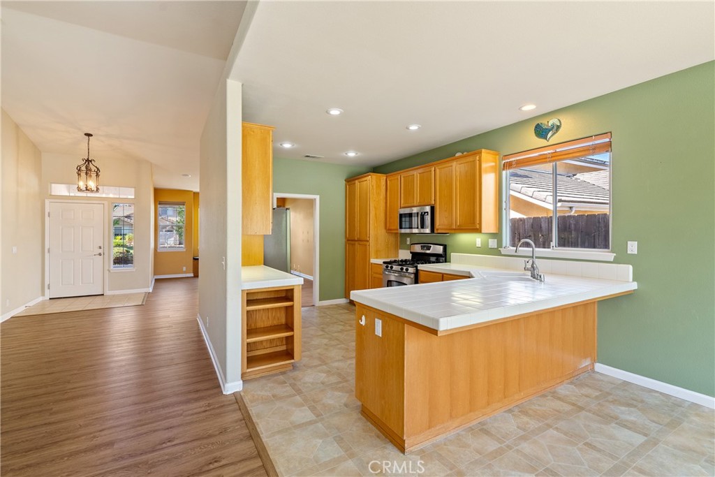 830 Sycamore Canyon Road Paso Robles, CA 93446 - Photo 8 of 27 a kitchen with a sink stove and cabinets