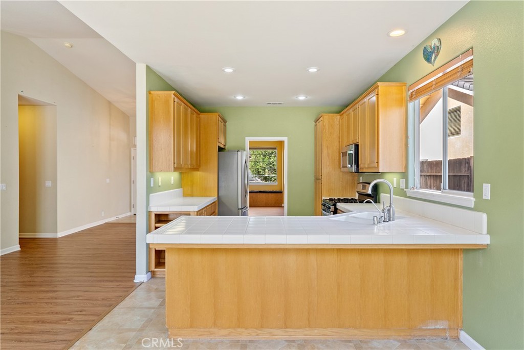 830 Sycamore Canyon Road Paso Robles, CA 93446 - Photo 9 of 27 a en suite bathroom with a granite countertop sink and a large mirror