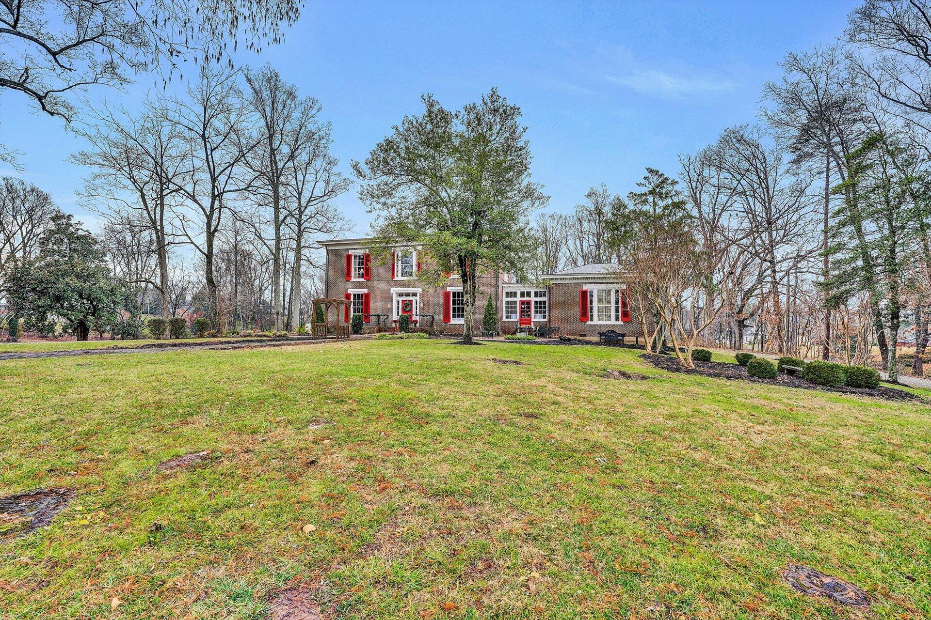 50 Floyd Avenue Rocky Mount, VA 24151 - Photo 69 of 73 a view of a house with a big yard and large trees