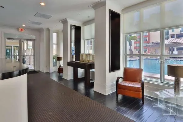 a living room with furniture and a coffee table with wooden floor