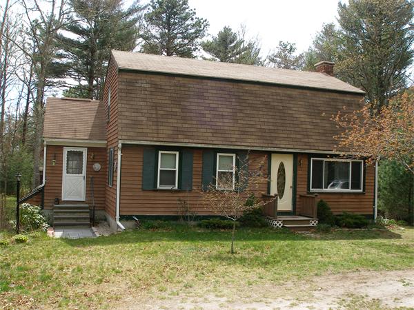 60 Cross Road Rochester, MA 02770 - Photo 1 of 2 a front view of a house with garden