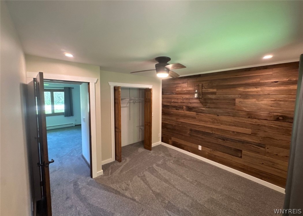 11806 Wyandale Road Concord, NY 14141 - Photo 24 of 34 1st floor bedroom with wood accent wall