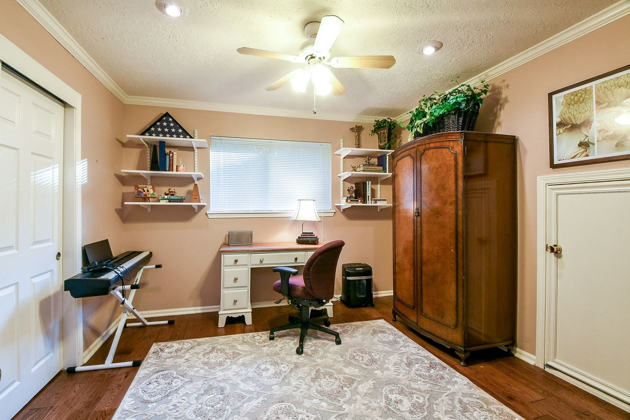 6607 Misty Springs Lane Spring, TX 77379 - Photo 19 of 31 This versatile bedroom doubles as an office, featuring a spacious closet and convenient attic access.